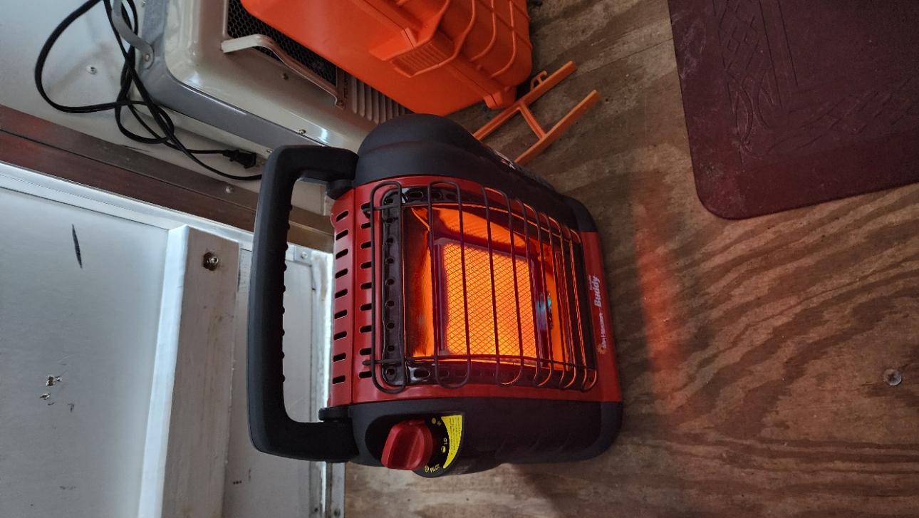 We purchased a small propane heater for the trailer. Worked well. Now if only we can get the door to stay closed.