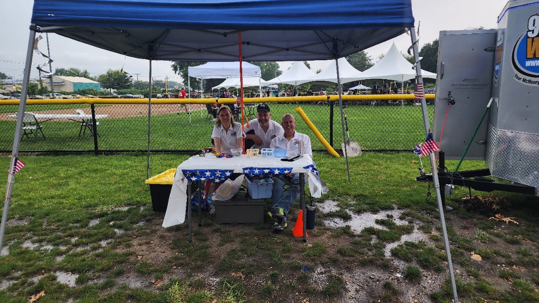 Georgette Serocki, Rick Block and Joe Serocki brave the downpour to share WYML bling!