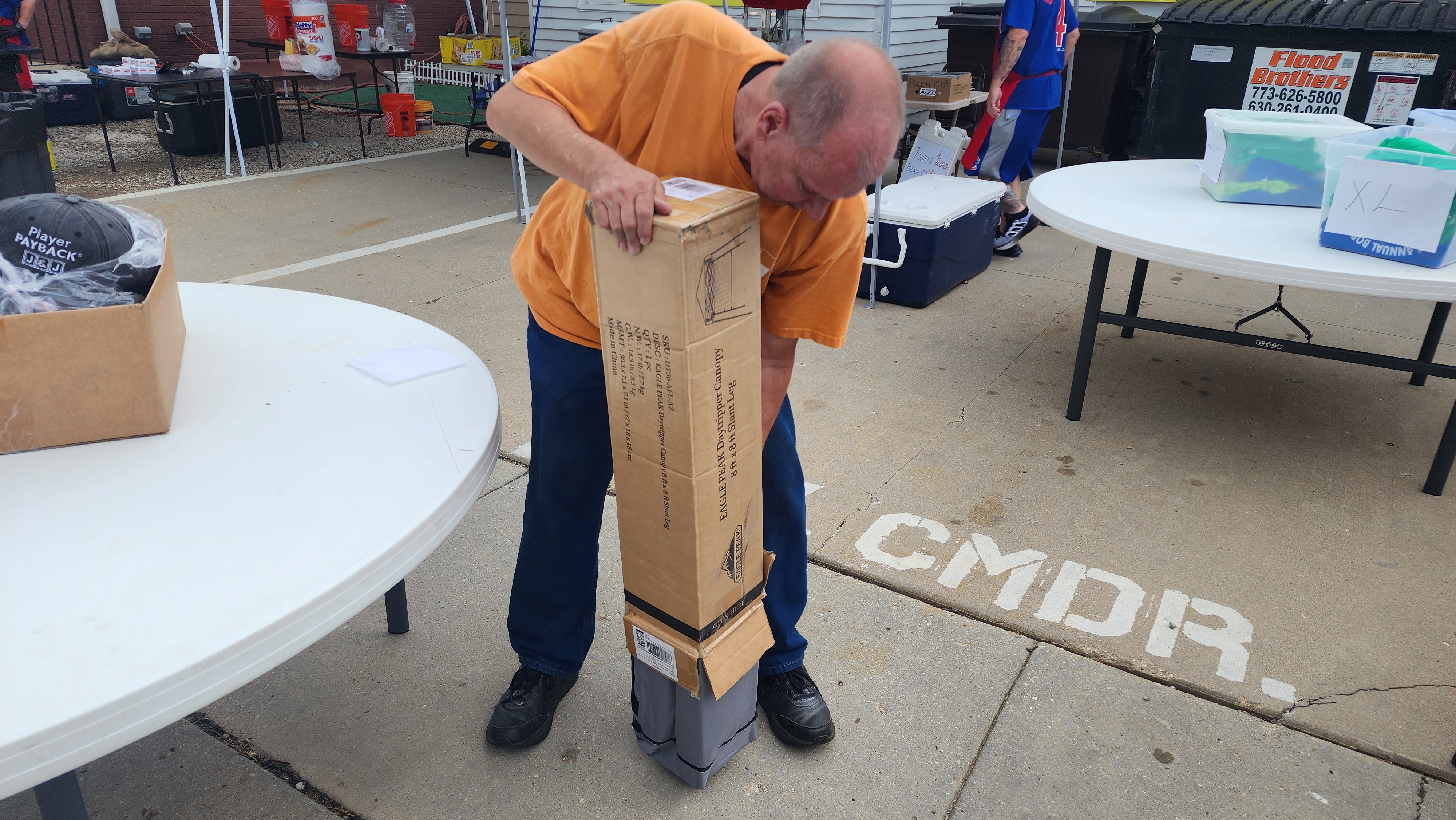 Joe unboxes a new canopy.