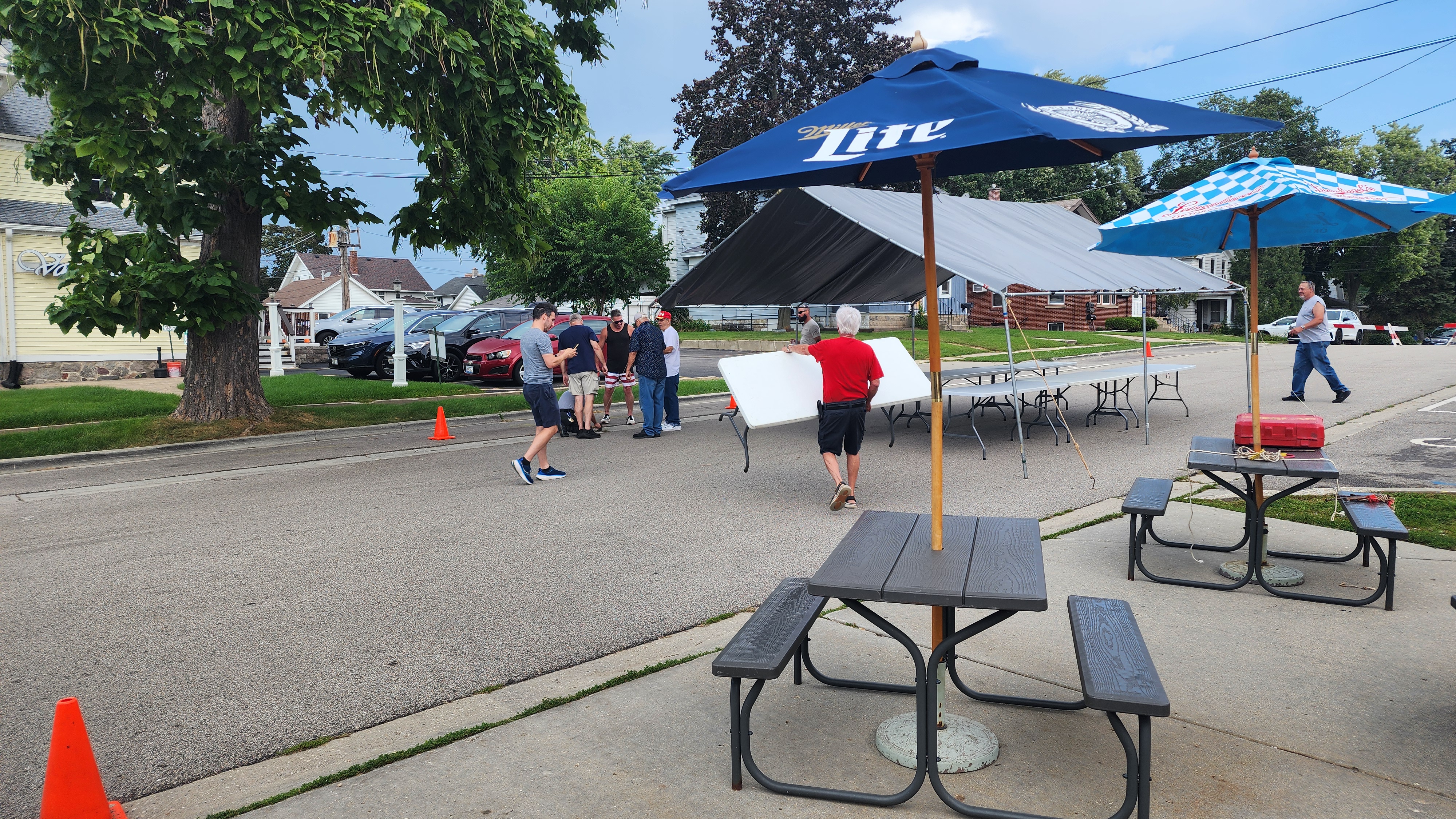 The members of PLAV setup tables in the street.